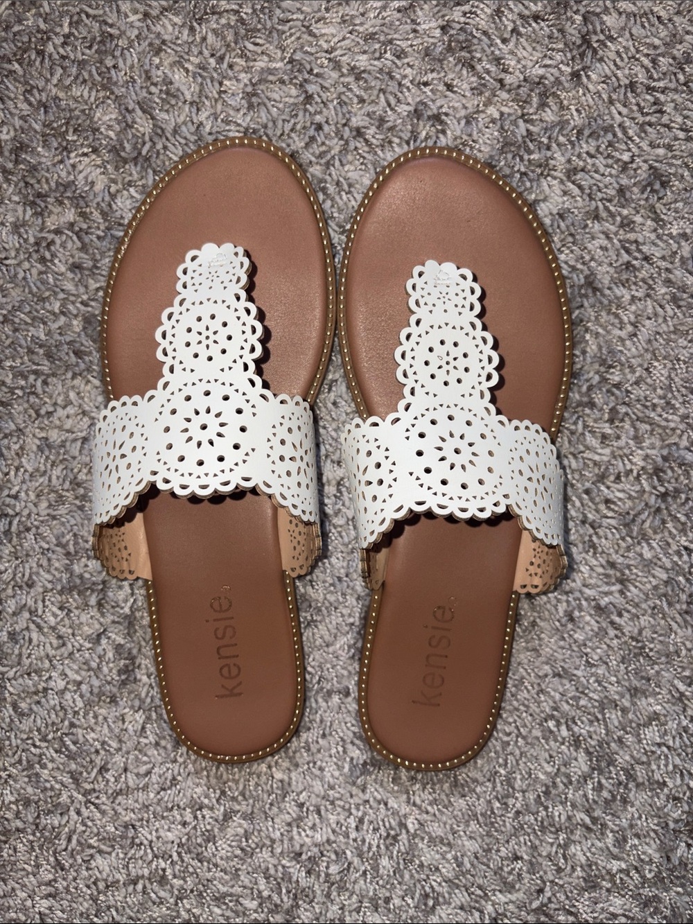 Kensie White Laser-Cut Scalloped Slide Sandals with gold adornment.